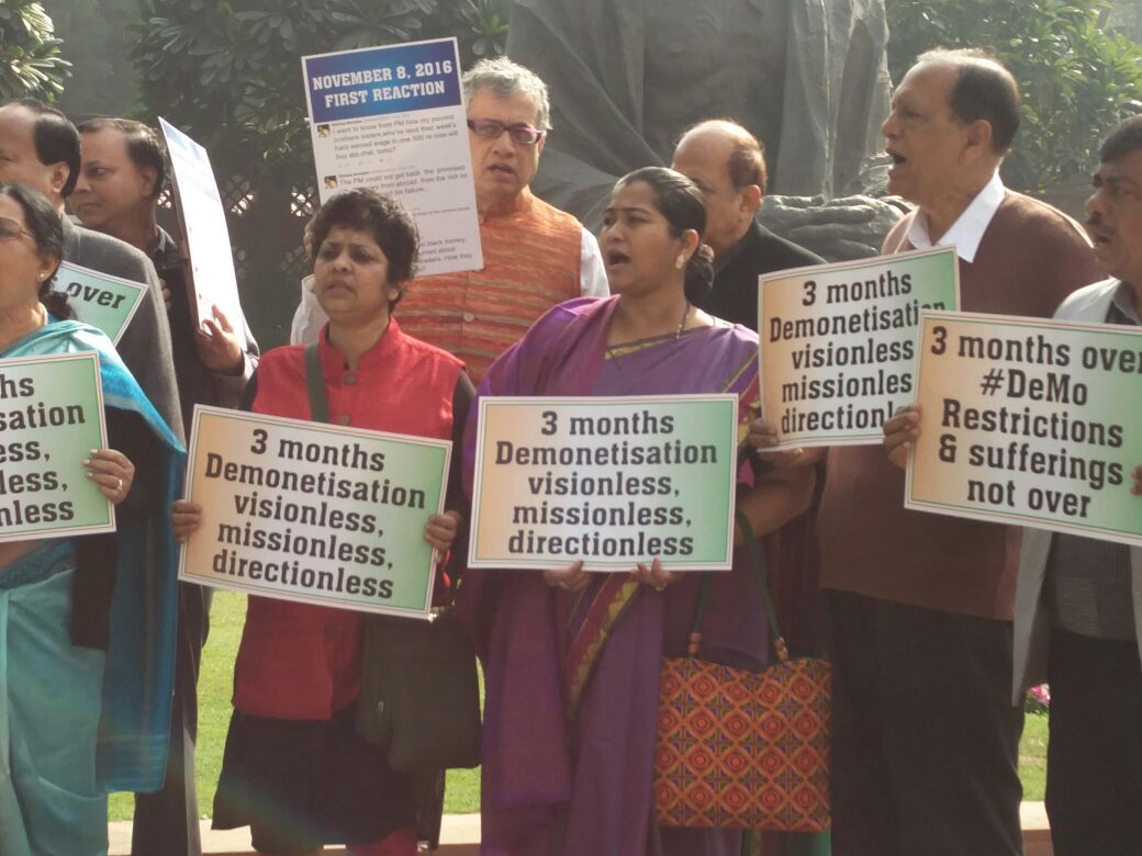 Trinamool stages dharna outside Parliament, protest in the House after three months of demonetisation Trinamool stages dharna outside Parliament, protest in the House after three months of demonetisation